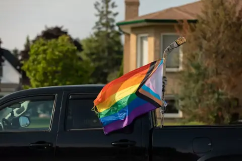 A rainbow Pride flag at the Colour Run, Walk & Wheel, 2024