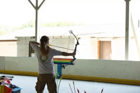 Archery with Rainbow Hood at Pride Manitoulin, 2024