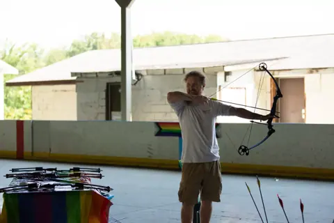 Archery with Rainbow Hood at Pride Manitoulin, 2024