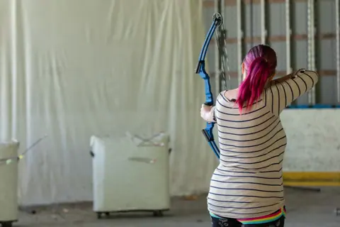 Archery with Rainbow Hood at Pride Manitoulin, 2024