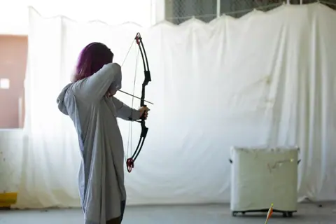 Archery with Rainbow Hood at Pride Manitoulin, 2024