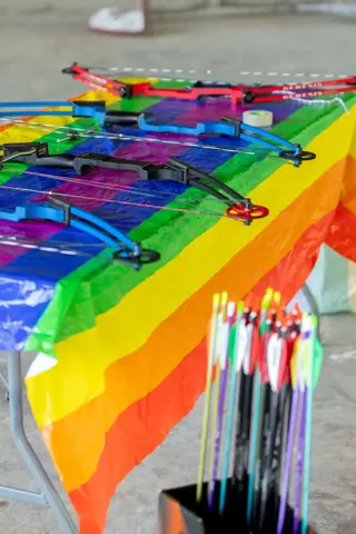 Archery with Rainbow Hood at Pride Manitoulin, 2024