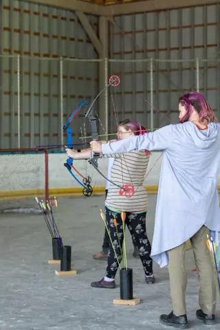 Archery with Rainbow Hood at Pride Manitoulin, 2024