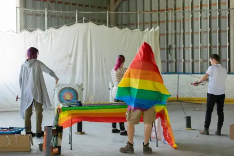 Archery with Rainbow Hood at Pride Manitoulin, 2024