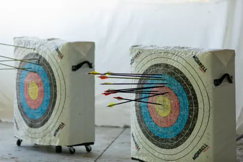Archery with Rainbow Hood at Pride Manitoulin, 2024
