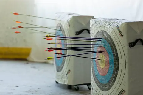 Archery with Rainbow Hood at Pride Manitoulin, 2024