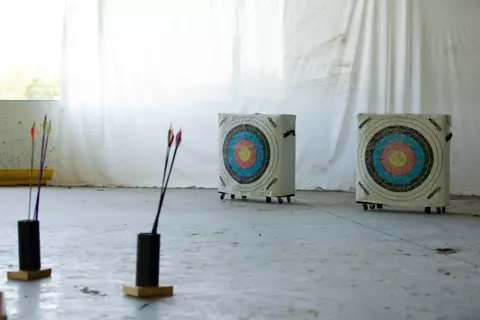 Archery with Rainbow Hood at Pride Manitoulin, 2024